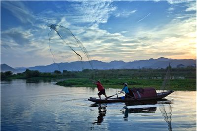 Picture Of Fishermen With Net At Lake