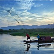 Picture Of Fishermen With Net At Lake